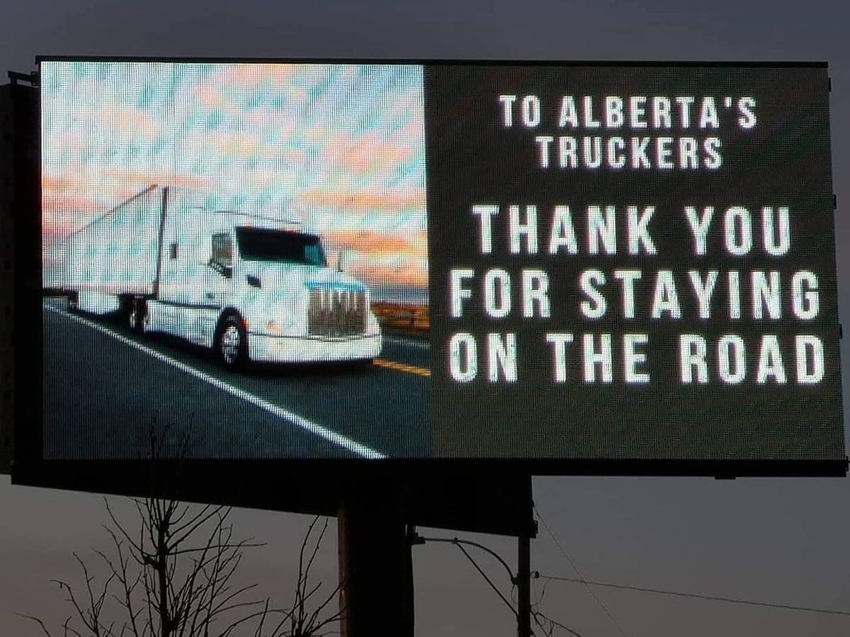 The board displaying a free community message thanking Alberta's truckers for staying on the road