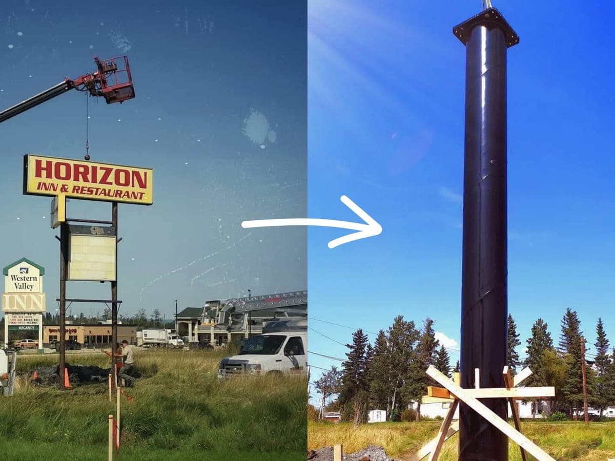 The old Horizon Inn sign being lifted out by a crane, and the new steel pole raised in its place
